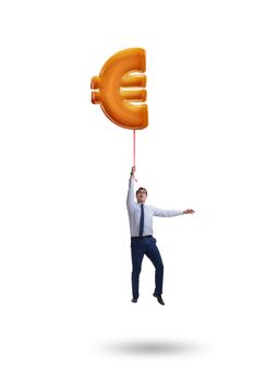 Businessman flying on euro sign inflatable balloon