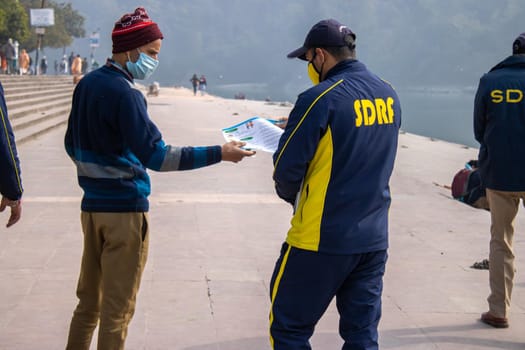 Haridwar, Uttarakhand India April 06, 2021. Policemen spreading awareness of protection from Coronavirus to stay safe from Coronavirus during Maha Kumbh 2021. Apple prores 422 High-quality 4k footage.