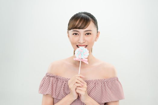 portrait Young woman with candy on white background