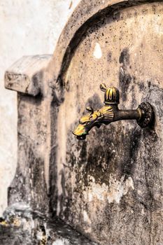 Old forged tap of a fountain in Chelva village, Valencia, Spain