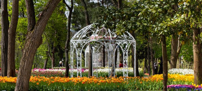 Little decorative pergola hut made in simple style in a garden