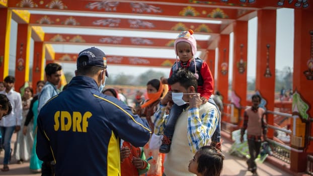 Haridwar, Uttarakhand India April 06, 2021. Policemen spreading awareness of protection from Coronavirus to stay safe from Coronavirus during Maha Kumbh 2021. Apple prores 422 High-quality 4k footage.