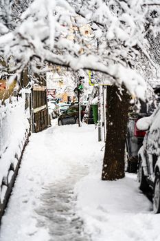 Path way made by people walking thru the snow in the morning. Path in heavy snow. Winter concept snow-path in the morning light