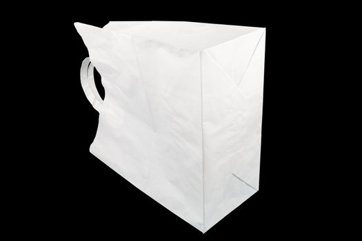 used white paper bag with handles isolated on black background.