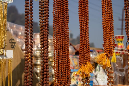 Haridwar, Uttarakhand, India, April 14, 2021.Indian shopkeeper shop selling religious material at Haridwar Uttarakhand India . High quality photo