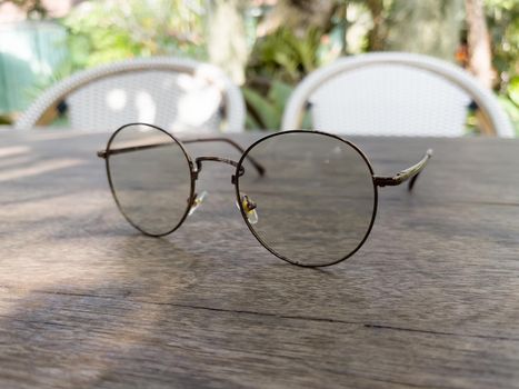 Eyeglasses on old wooden table, stock photo