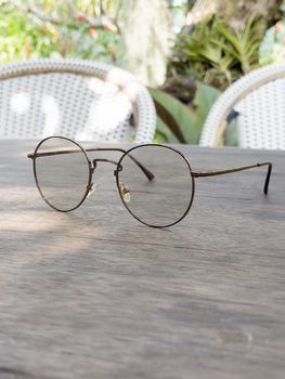 Eyeglasses on old wooden table, stock photo