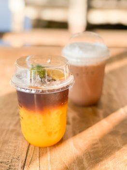 A glass of iced americano with orange juice, stock photo