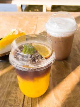 A glass of iced americano with orange juice, stock photo