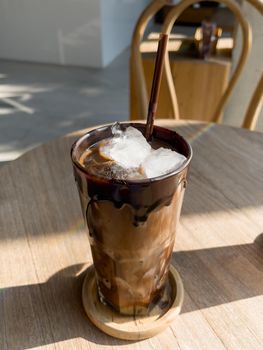 Iced mocha on wooden table, stock photo