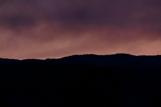 Photograph of bushfire smoke at sunset from hazard reduction burning in the Blue Mountains in New South Wales in Australia