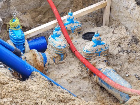 Replacing of broken pipes with PVC tubes for water delivery. Drink water piping with 250mm waga multi joint member.