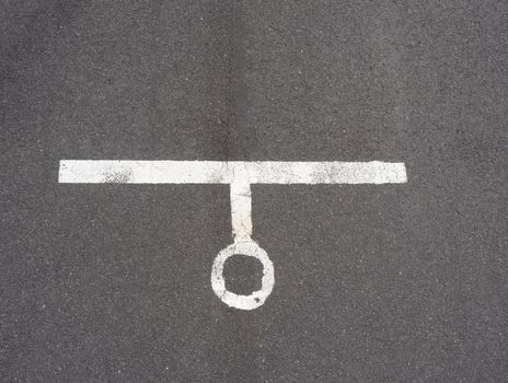 White paint line on old obsolete asphalt plaground. Empty kids areal.
