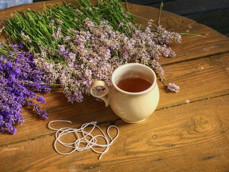 Hands prepare bunches of medicinal herbs. Herbal medicine.