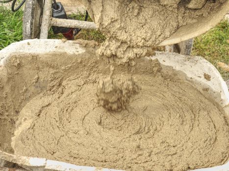 Concrete mixer detail. Making concrete in the mixer at the construction site