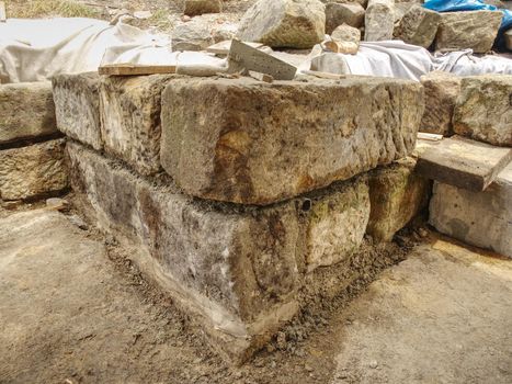 Natural stone wall, sandstone texture. Using of historical soft sand stones prepare for rebuilding of old house.