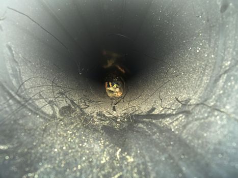 Inside of HDPE pipe. Laying of high press plastic water pipes at building side. Process of using plastic tubes