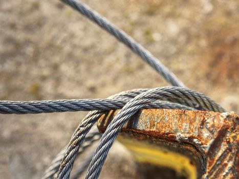 Shackles attached to wire cables and safety net.  Stainless steel screw bolt and wires for maintaining tightened safety net