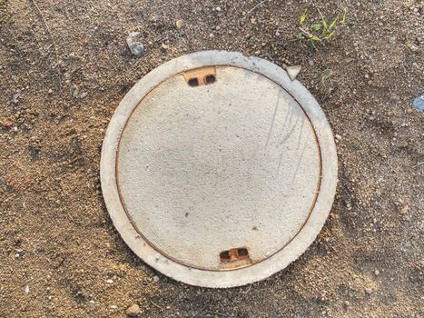 Manhole with the concrete cover on the concrete basement