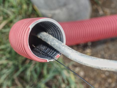 Wire protection for city light system in park. Steel grounding cable in system. 