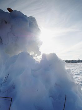 Sunset over freeze ice hole, lovely winter season background with reflection