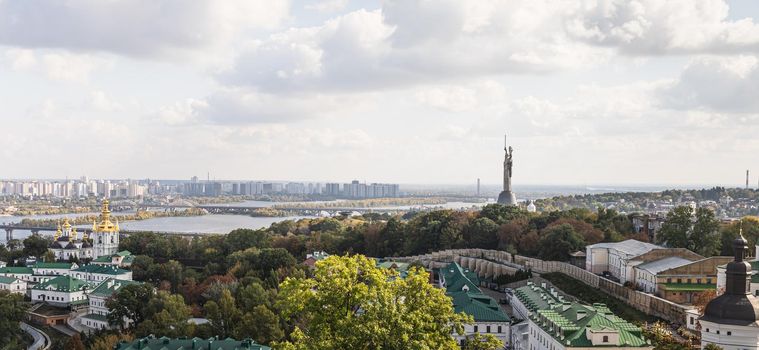 Aerial view on Kyiv city, Dnipro River, Motherland Monument and Kyiv Pechersk Lavra.
