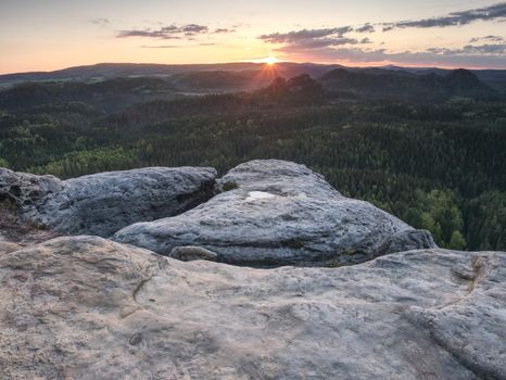 Hike climbing mountains, peaks and rounded forest peaks. Clean fresh air on a Sunny morning among the rocks