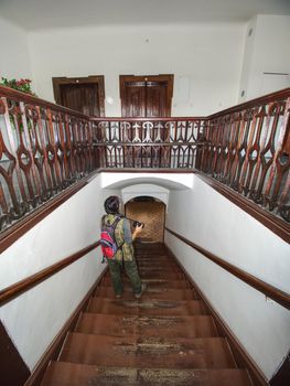 Hobby photographer takes photo of interior house built in 19th sentury.  Wooden staircase in middle of burgher house.