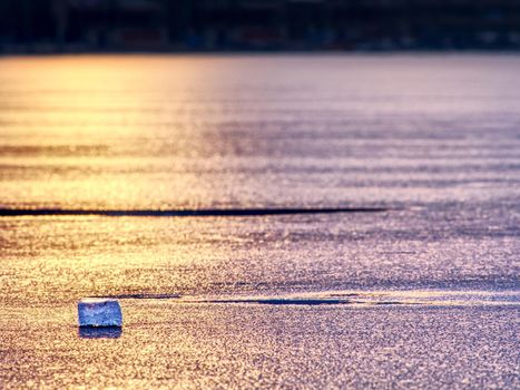 Natural winter icy background of defocused ice with copy space. Blue purple colors of ie floes