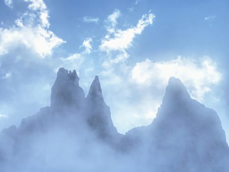 Tre Cime di Lavaredo in sunny April evening, view from tour around at sunset, Dolomite Alps Italy