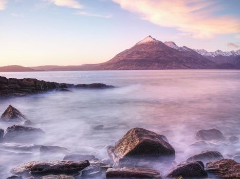 Rocks near Elgol,  Loch Scavaig,  Isle of Skye Scotland. Warm sunset colors in cold February evening. Popular photographers destination.