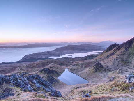 Small lake on the mountains and of Scottish Highlands. Scenic Landscape View of Mountain