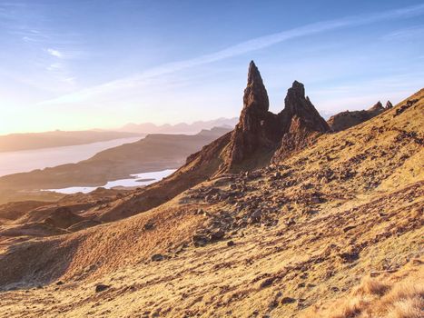 Morning view of Old Man of Storr rocks formation and lake Scotland. The one of the most photographed wonders in the Scotland.