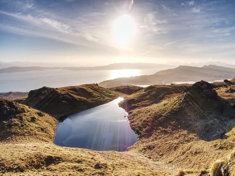 Small lake on the mountains and of Scottish Highlands. Scenic Landscape View of Mountain