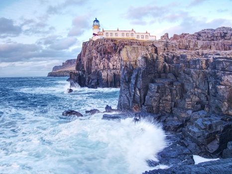 Abandoned building of popular Neist Point.with tower against to evening sky.  Out of season. 