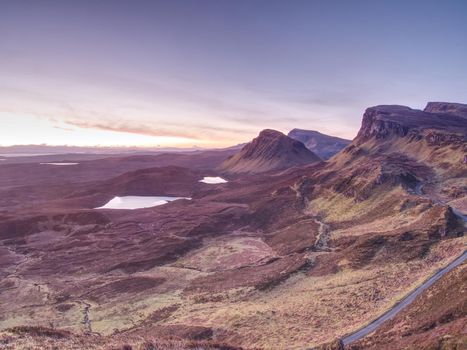 Landscape view of Quiraing mountains on Isle of Skye in the highlands of Scotland. Sunny morning view