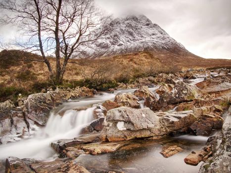 Cold winter day on meadow at river Coupall at delta to river Etive  near Glencoe in the Scottish highlands