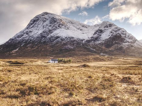 Snowcapped mountains in Scottish Highlands near Glencoe, Scotland. Fresh snow covered peaks of mountains.