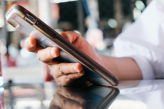 close up image of Teenage girl text messaging on her phone