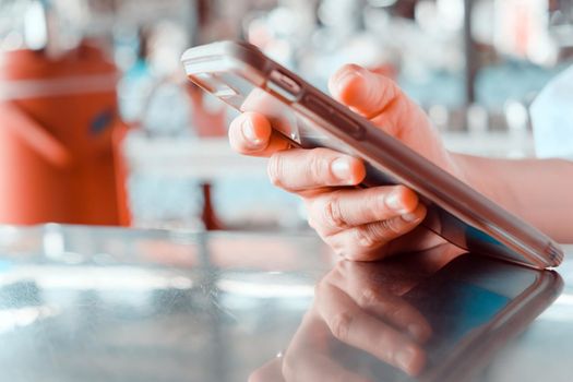 close up image of Teenage girl text messaging on her phone