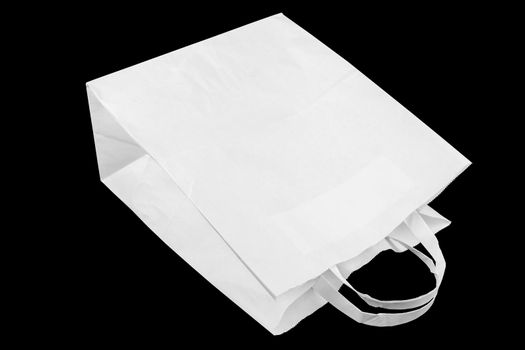used white paper bag with handles isolated on black background.