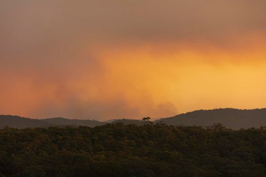 Photograph of bushfire smoke at sunset from hazard reduction burning in the Blue Mountains in New South Wales in Australia