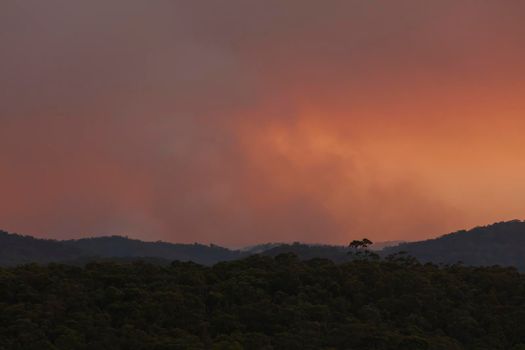 Photograph of bushfire smoke at sunset from hazard reduction burning in the Blue Mountains in New South Wales in Australia