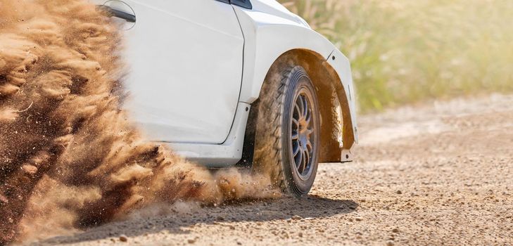 Rally racing car on dirt track.