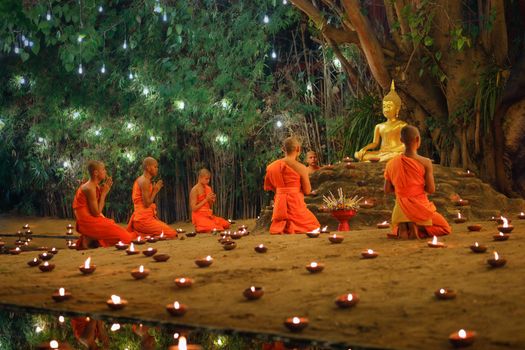 CHIANG MAI THAILAND - Feb 19 : Makha Bucha Day is the important incidents Buddhist day. Buddhist monk fire candles to the Buddha. February 19,2019 in Phan Tao Temple, Chiangmai, Thailand.