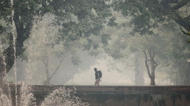 Tourist walk in smoke pollution over Chiang Mai Thailand.