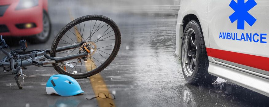 Accident car crash with bicycle on road ,rainy day.