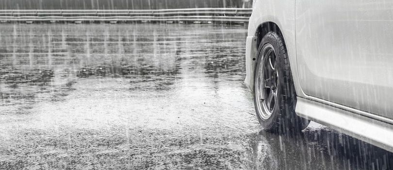 Heavy rain and puddles on the road