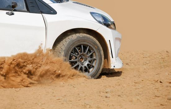 Rally racing car on dirt track.