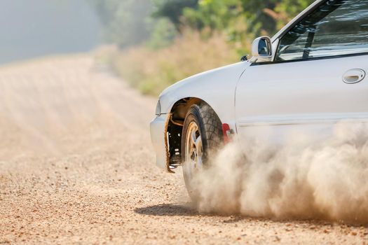 Rally racing car on dirt track.